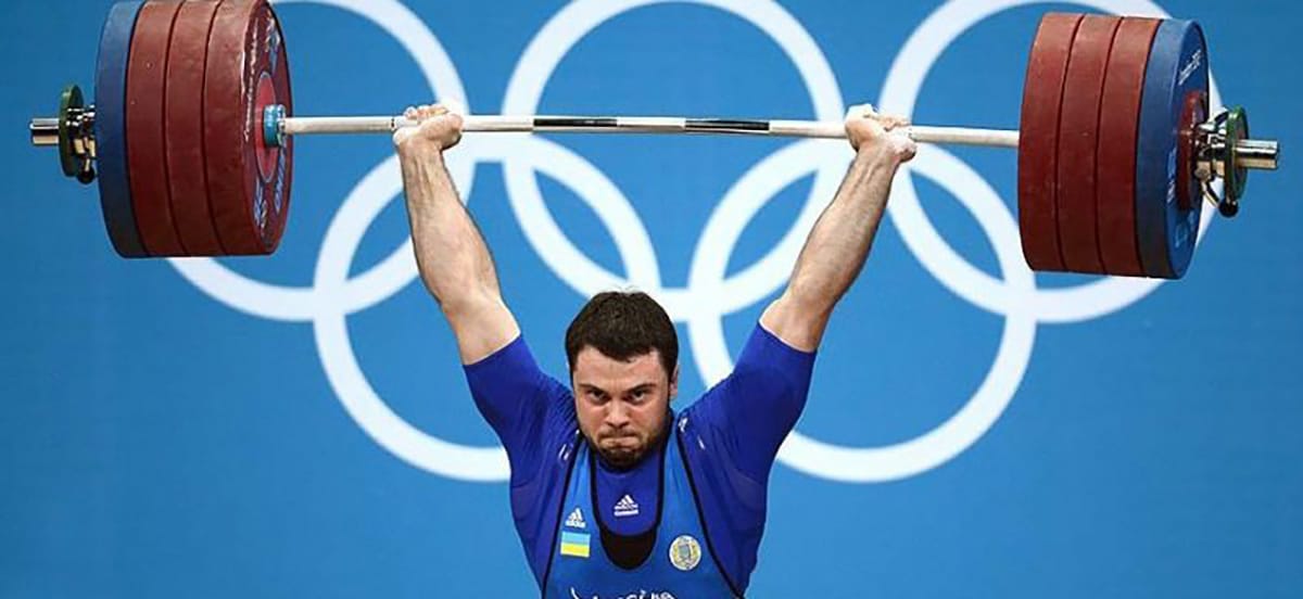 weightlifter with the weight up