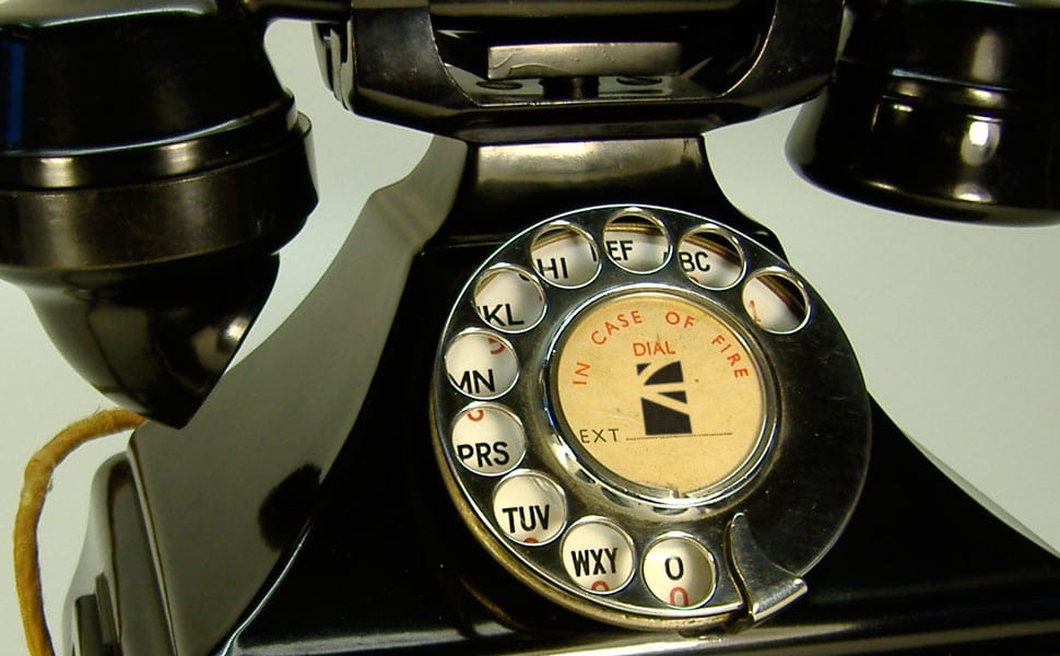 Old black phone with the logo of GAYARRE infografia